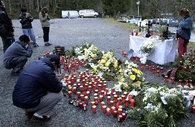 Relatives of 10 Japanese victims mourn before altar in Kaprun